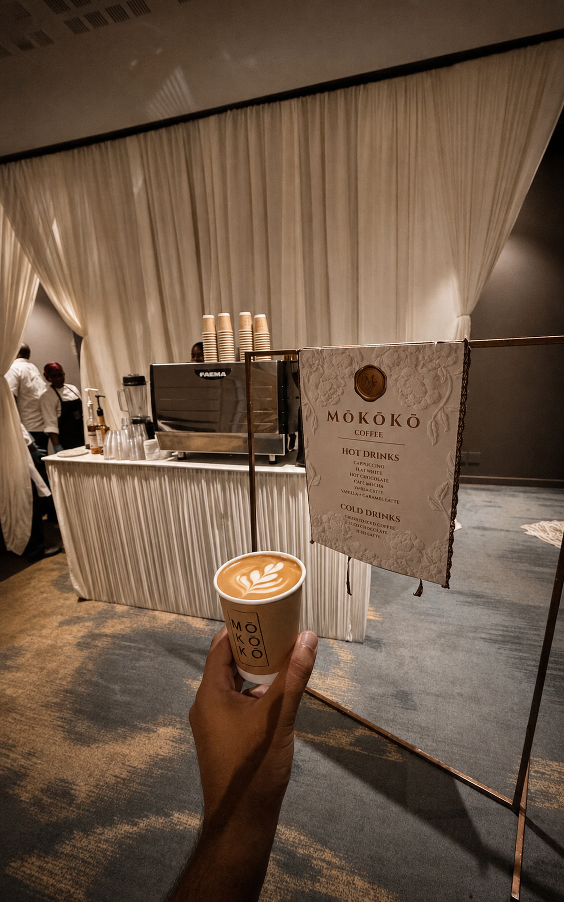 Coffee in hand at a wedding setup — hospitality detail.